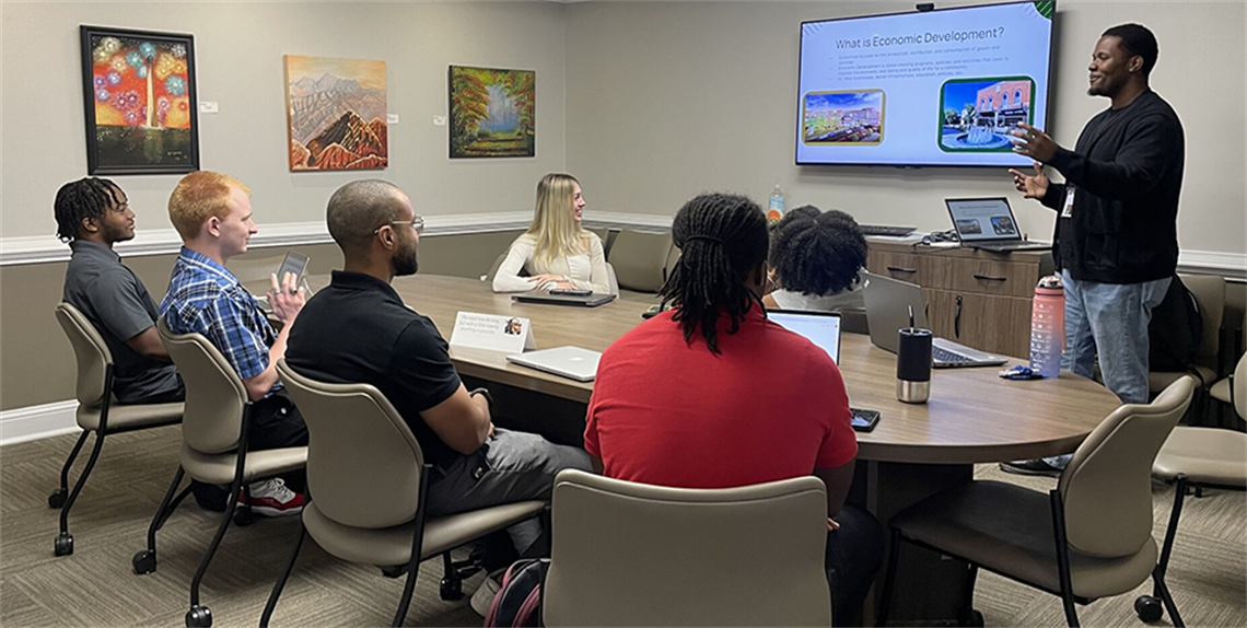 Interns in meeting room going through Orientation