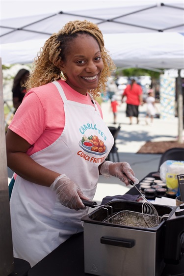 Charlotte frying up Conch Fritters