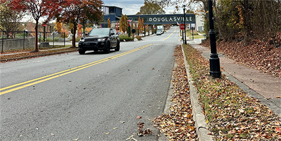 Looking west down Church St with leaves on sidewalk